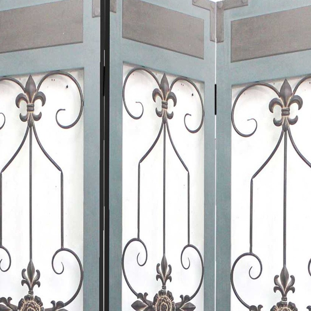 Blue metal folding three-panel screen room divider with decorative panels and fleur-de-lis scrollwork.