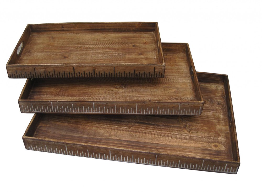 Three rustic wooden serving trays with ruler-marked edges, stacked in increasing sizes.