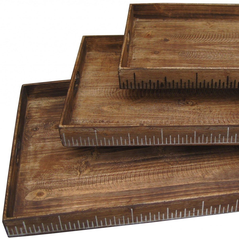 Rustic wooden rectangular shallow trays in varying sizes with ruler-scale markings along the front edges.