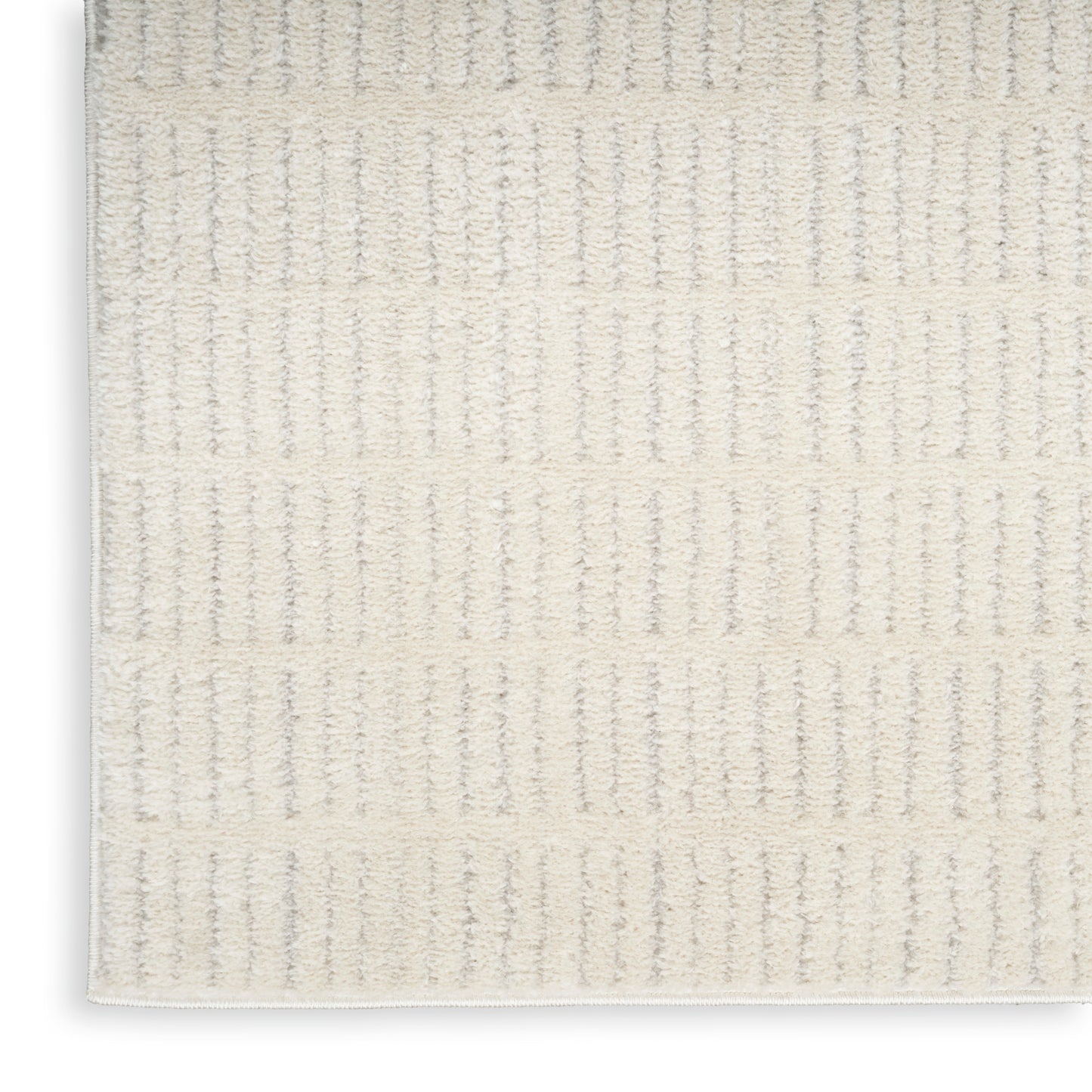 Cream ribbed textured 10' runner rug with soft loop pile; Scandinavian-inspired neutral-colored runner for hallway or living area.