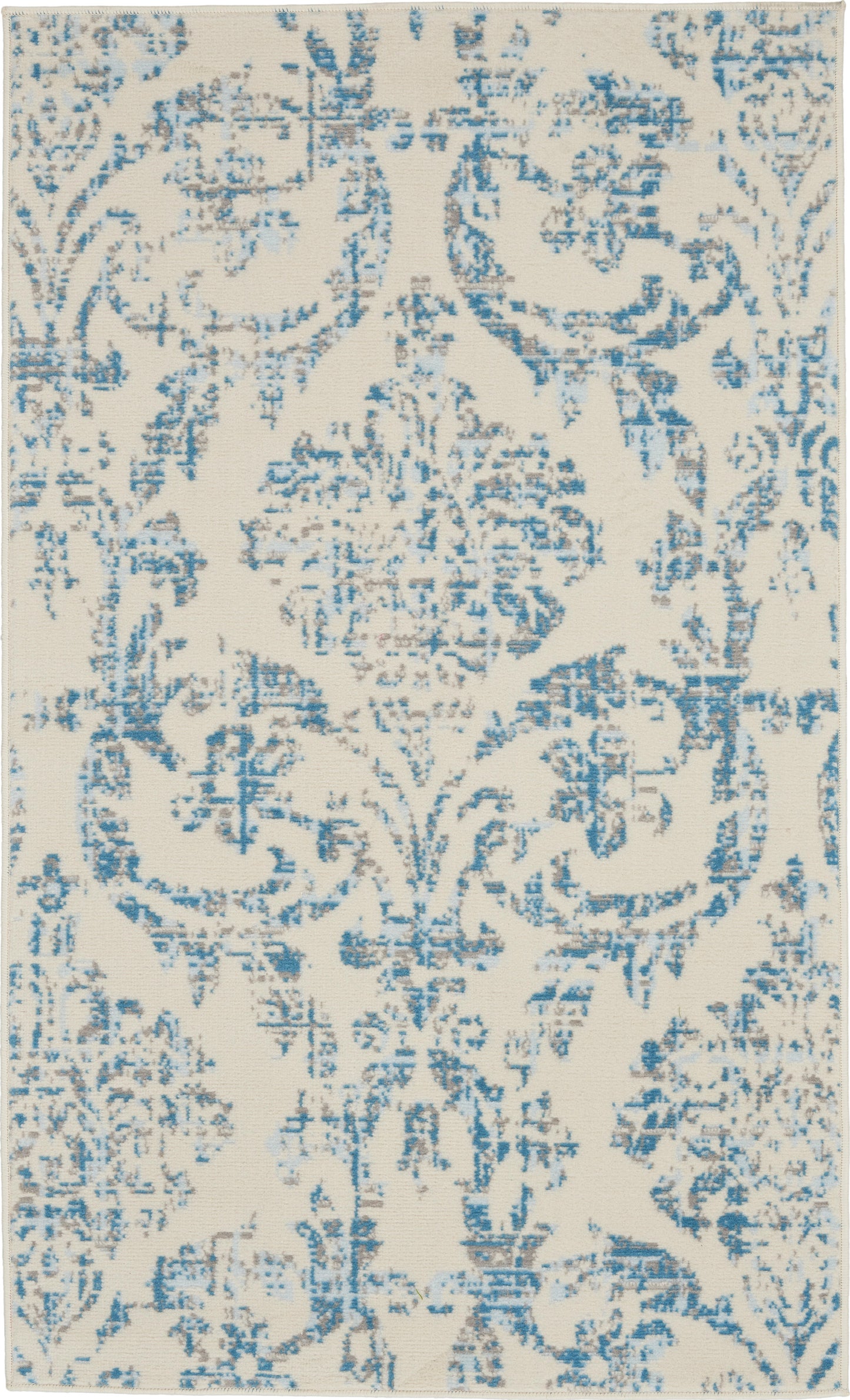Rectangular cream rug with blue distressed damask pattern; vintage-inspired ornamental design.