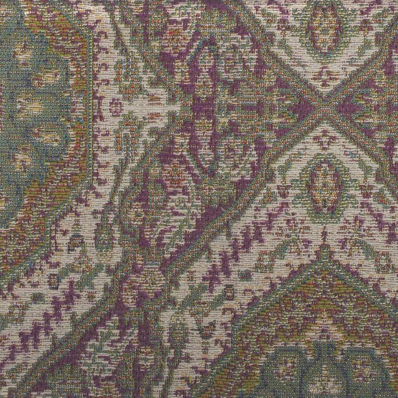 Upholstery fabric in purple, sage green and beige with a Persian-inspired pattern of diamond medallions and floral motifs.