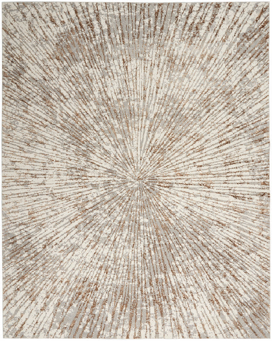 Rectangular area rug in cream and tan with a radiating sunburst pattern and plush pile.