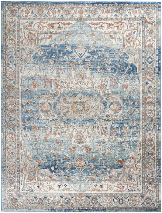 Persian-inspired area rug in blue, ivory, and tan with an ornate floral medallion center and detailed border.