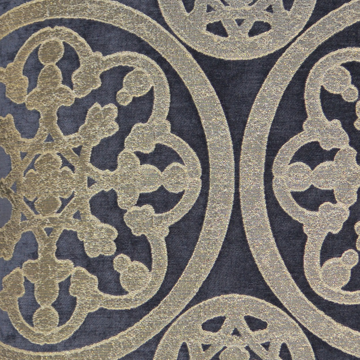 Navy blue fabric with gold ornate circular damask medallions and floral scrollwork.