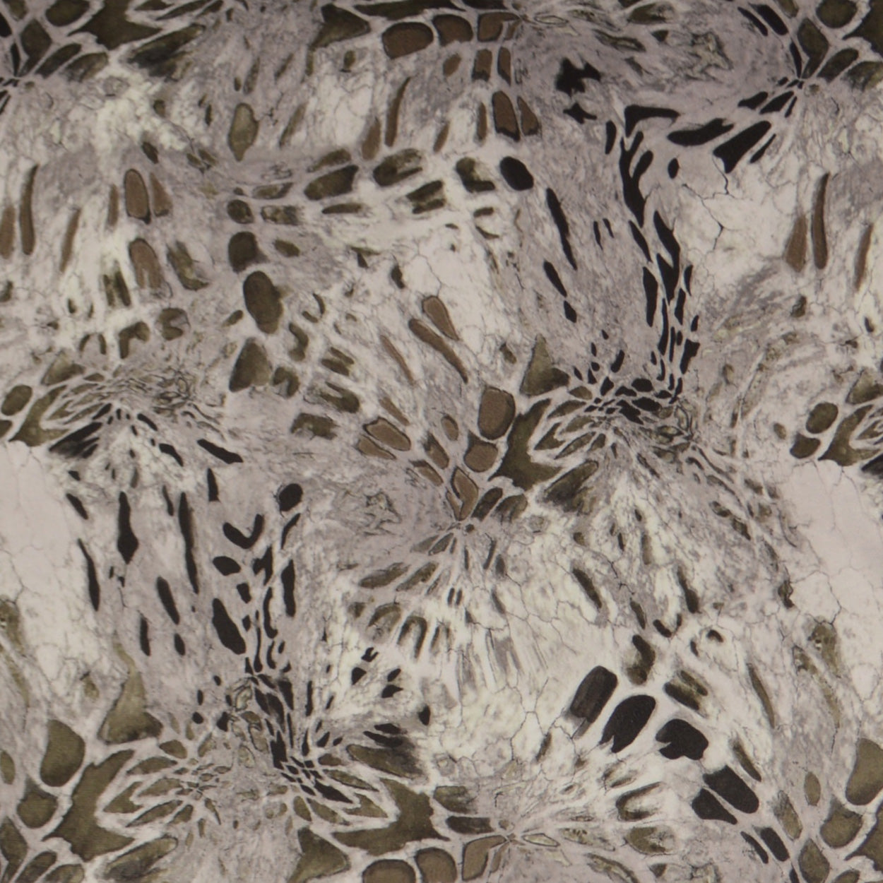 Beige pillow fabric with abstract brown-taupe swirls and leaf-like motifs in a marbled pattern.