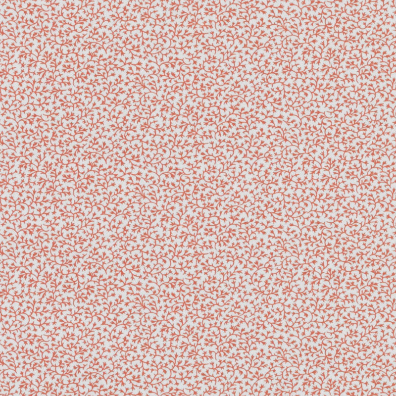 Cream background with a tiny orange coral-ditsy print of vine-like branches.