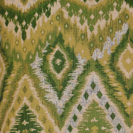 Green and yellow ikat-pattern fabric with diamond motifs and woven texture.