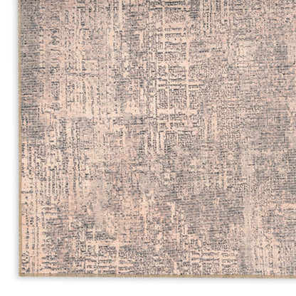 Neutral gray and beige distressed abstract patterned rectangular rug with textured weave.