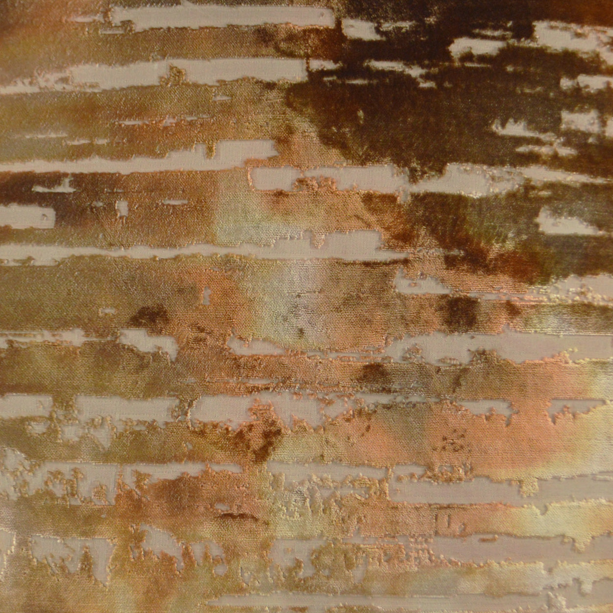 Caramel textured pillow with brick-patterned fabric in warm beige, tan, brown and rust tones; 24" x 24" square.