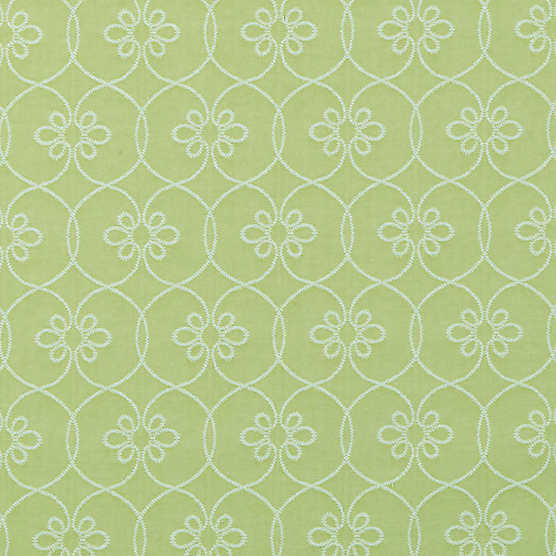 Lime green fabric with white embroidered circular lattice pattern and small floral clusters at each intersection.