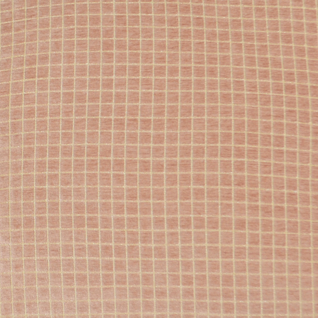 Peach-pink woven fabric with small white square grid pattern; lightweight cotton look, ideal for shirts or summer dresses.