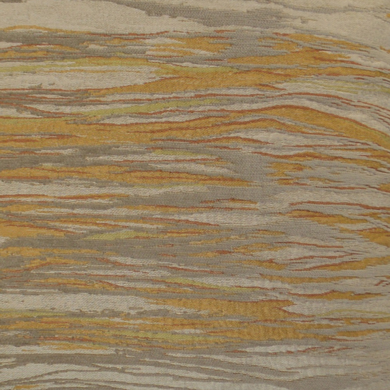 Woven fabric with rusty orange, mustard, tan and gray wavy stripes on a beige base.