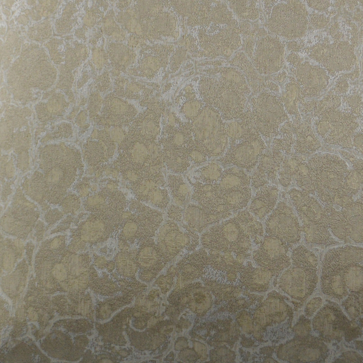 Beige-gold textured fabric with irregular damask/vein pattern and subtle metallic sheen for upholstery.