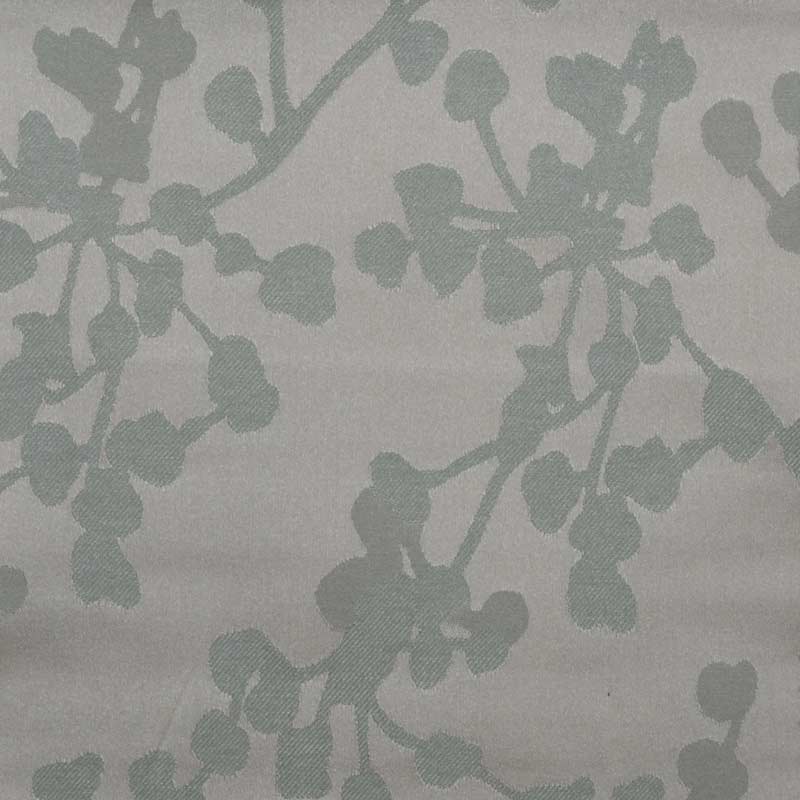 Muted sage-green botanical branch print on light gray upholstery fabric.