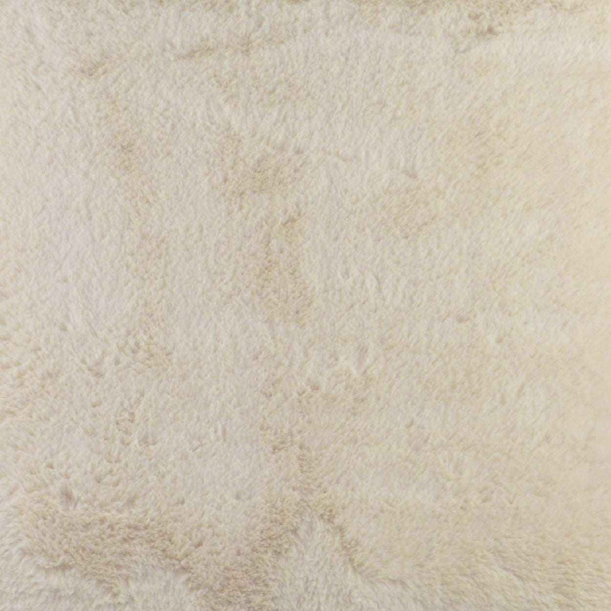 Cream-beige plush fabric close-up; soft fuzzy texture ideal for throws or upholstery.