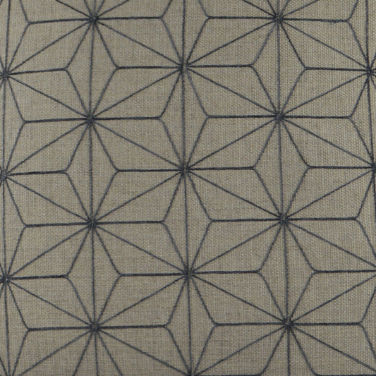 Taupe woven fabric with dark blue geometric star/diamond lattice; repeating hexagon rosettes for modern upholstery.