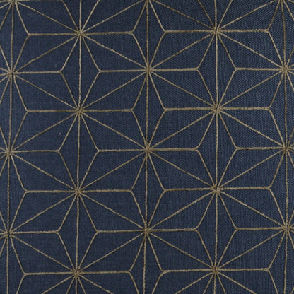 Navy pillow with a geometric nautical pattern and gold metallic accents; 24" x 24" square.