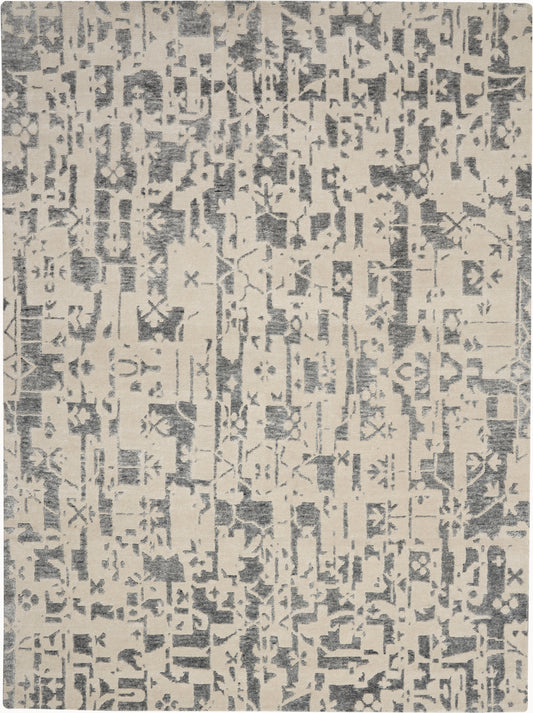 Beige rug featuring a gray distressed geometric pattern in a modern abstract block design.