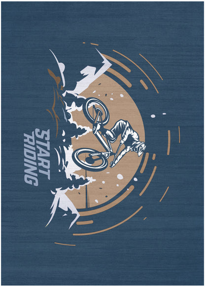 Navy fabric wall art with tan circle, white biker mid-air, orange motion rings, and 'START TRICKING' vertical text.