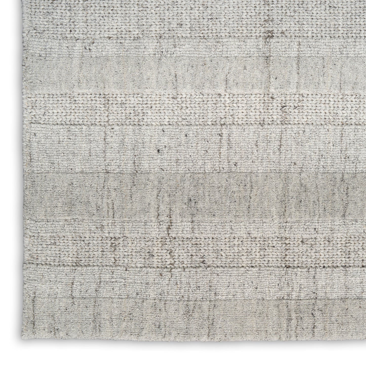 Light gray-beige woven rug with subtle horizontal stripes and textured surface; low-pile rectangular area rug.