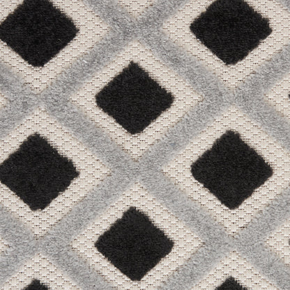 Geometric runner rug featuring charcoal diamond motifs within light gray lattice on beige background; tufted woven texture.
