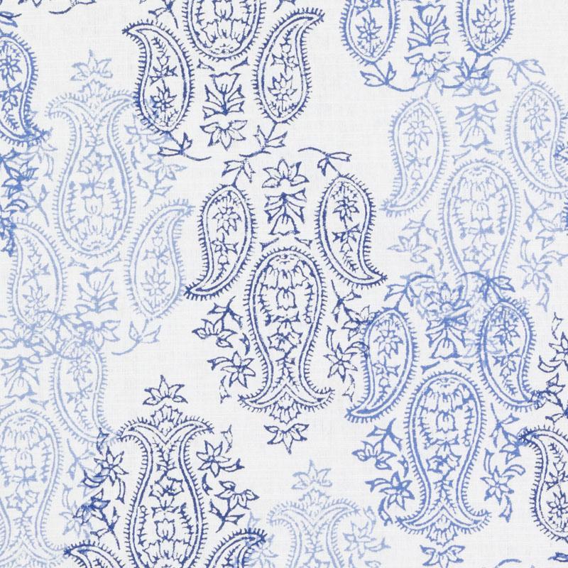 Blue and indigo paisley floral pattern on white fabric; textile print.