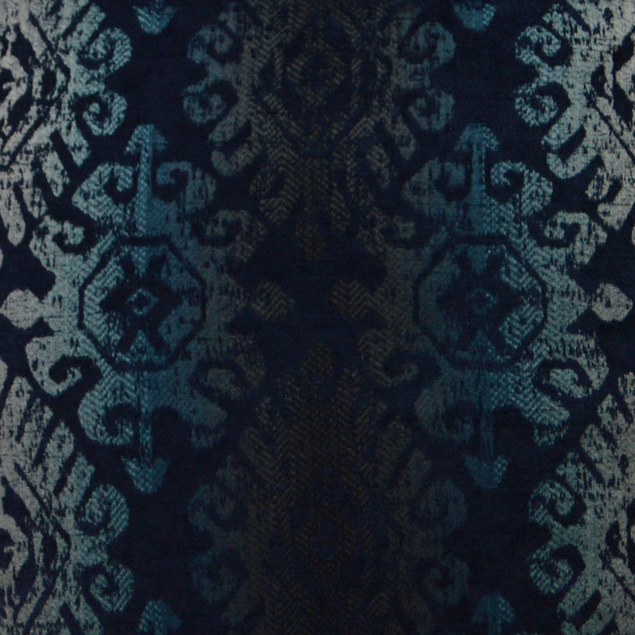 Navy jacquard damask fabric with teal ornate motifs and rich woven texture for upholstery or curtains.