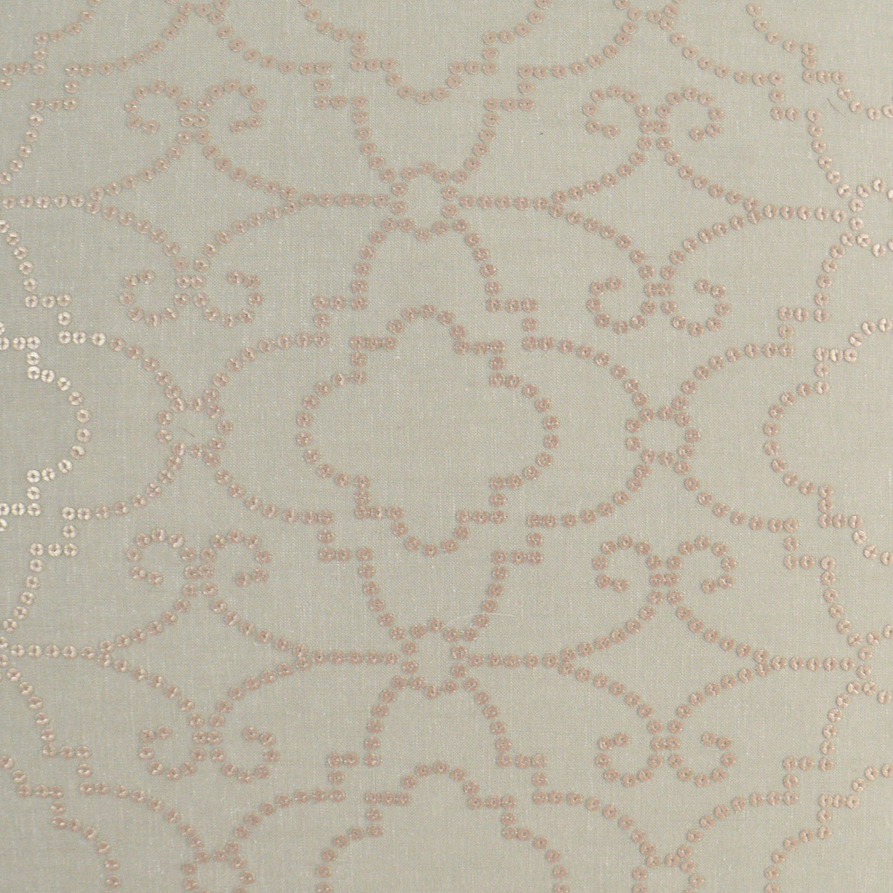 Cream pillow with a pale pink dotted beaded damask scroll pattern, 24" x 24".