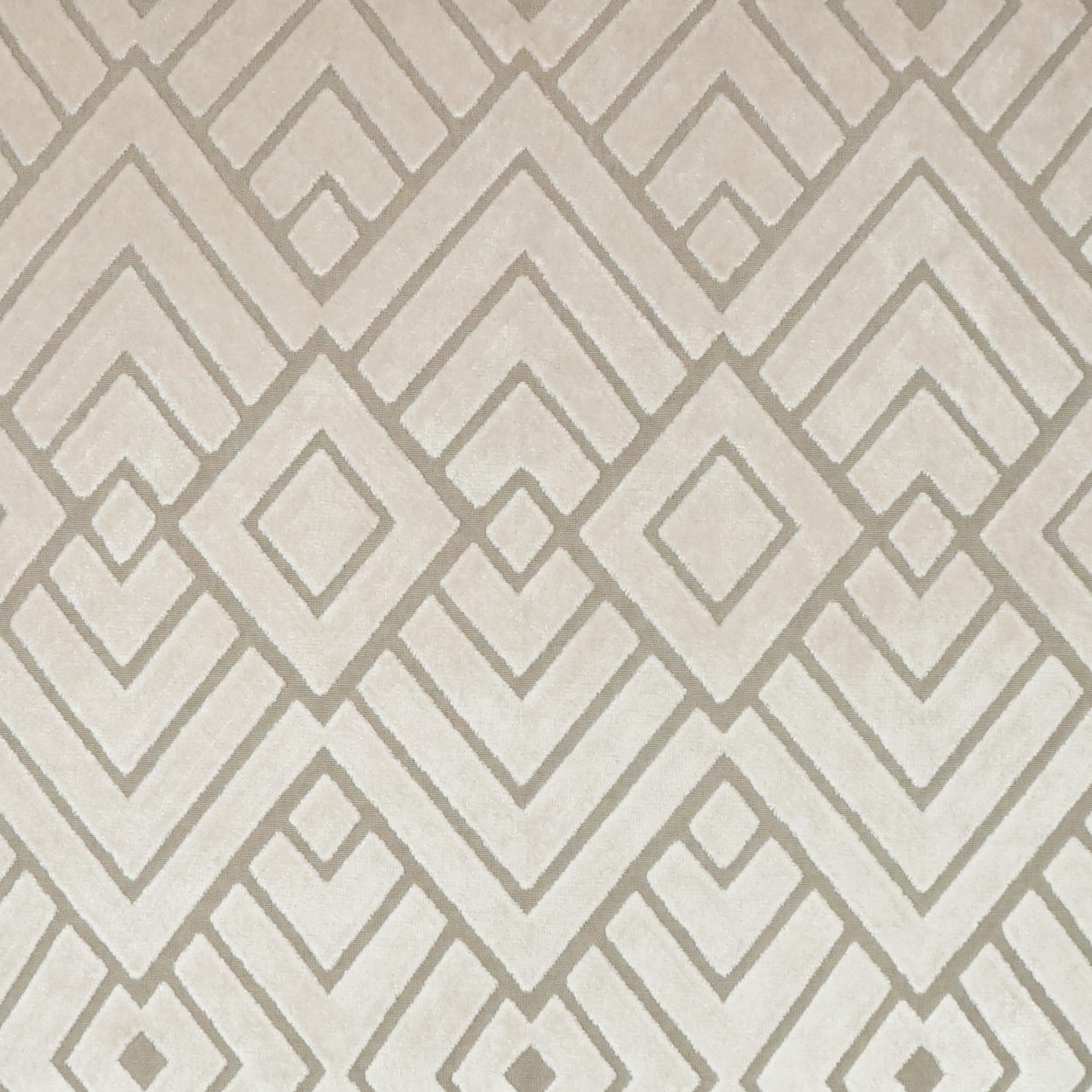 Beige fabric with an interlocking taupe diamond pattern; nested diamonds create a geometric, textured look.