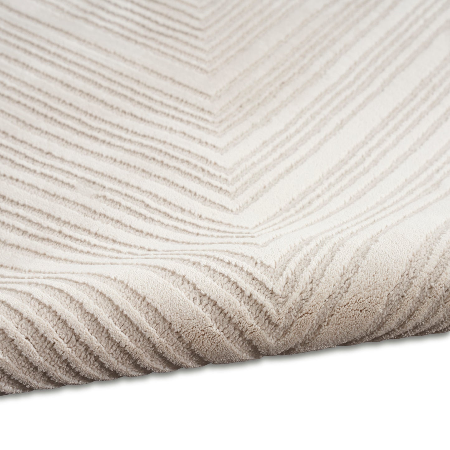 Beige textured rug with cream chevron pattern; plush pile for a cozy modern living room.