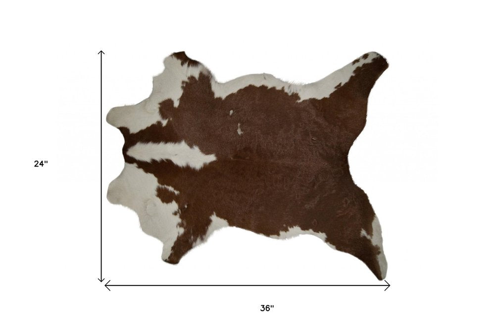 2' X 3' Brown And White Cowhide Cowhide Print Hand Tufted Area Rug