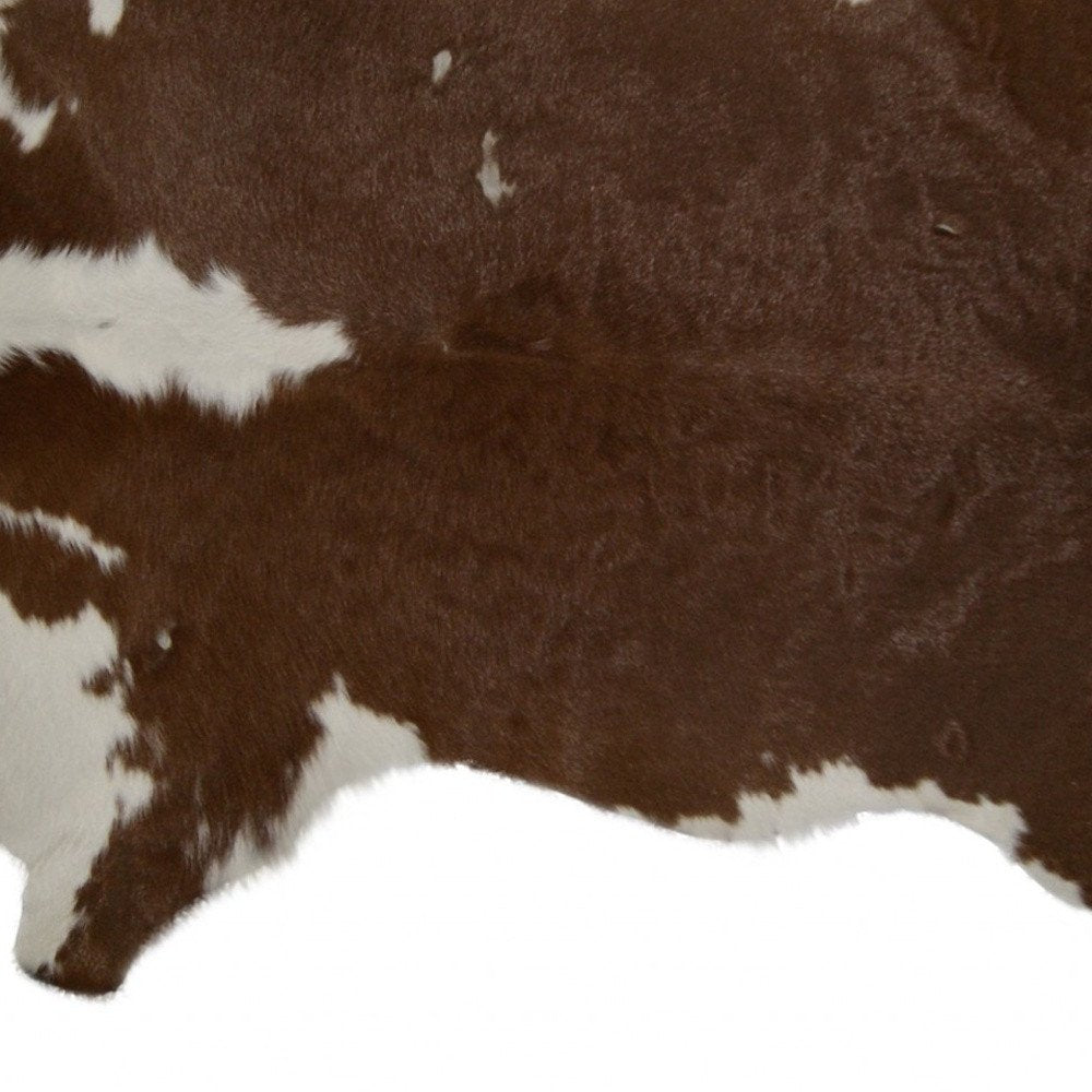 2' X 3' Brown And White Cowhide Cowhide Print Hand Tufted Area Rug