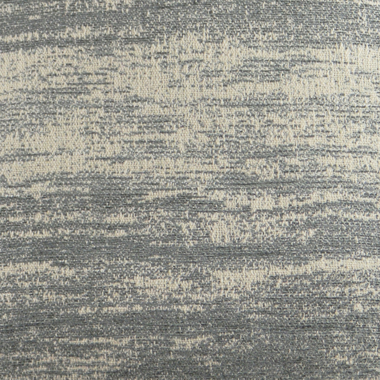 Pillow with blue-gray textured woven fabric and cream speckles.