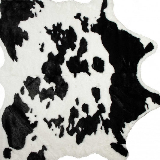 4' X 5' Faux Cow Hide Brown And White Area Rug