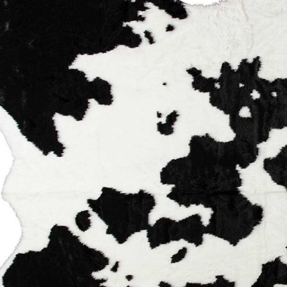 5' X 8' Black And White Cowhide Print Washable Area Rug