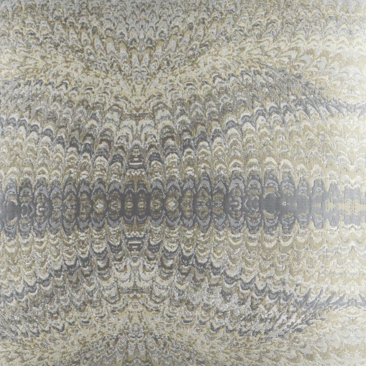 Close-up of beige & gray woven fabric on a pillow with concentric, wavy motifs and a textured surface.