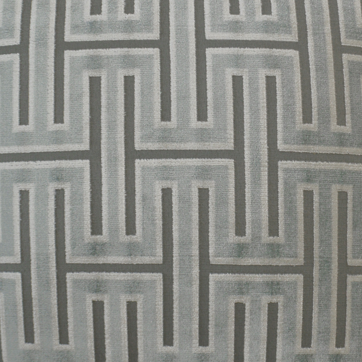 Gray fabric with interlocking Greek key pattern in light and dark gray; upholstery or drapery textile.