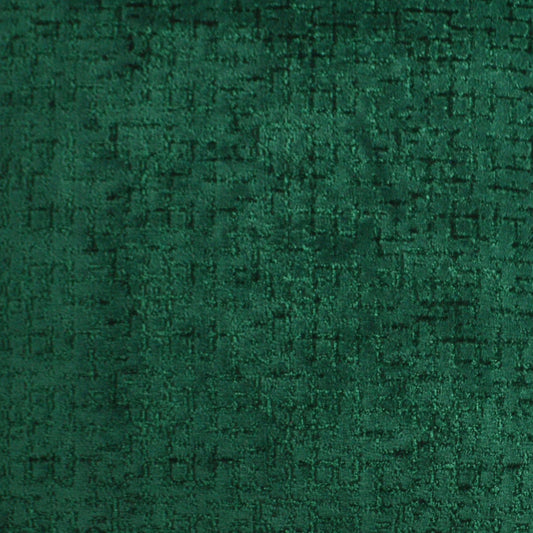 Emerald green velvet fabric close-up with plush nap and subtle sheen.