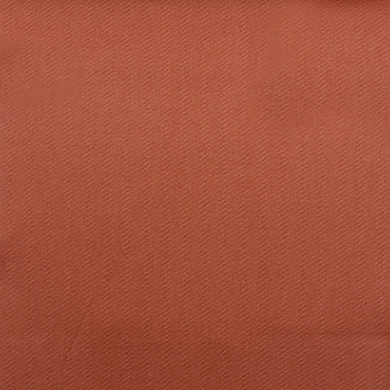 Rust-orange woven fabric close-up with fine texture.