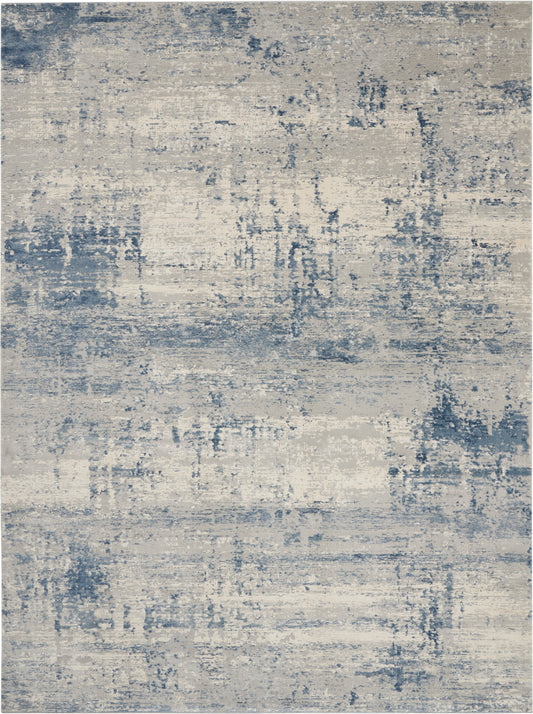 Abstract blue-gray area rug with a distressed, painterly pattern for modern interiors.