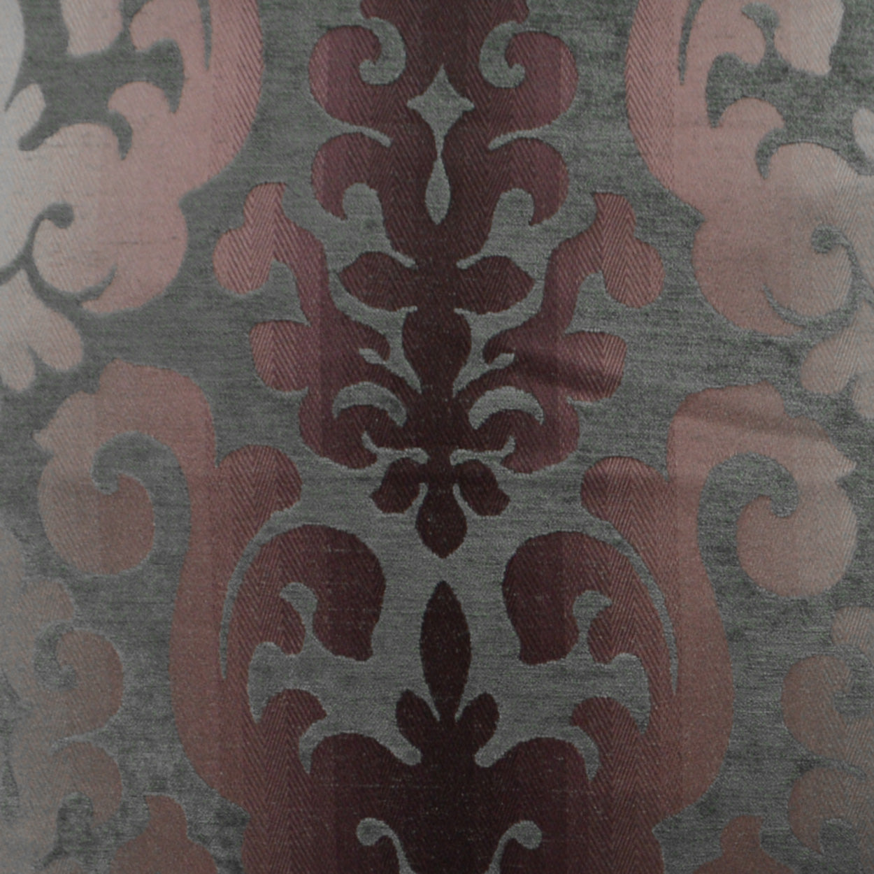 Gray fabric with burgundy-pink damask pattern; ornate ornamental upholstery textile.