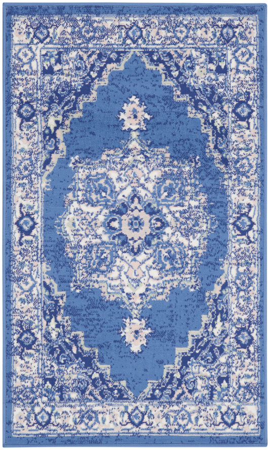 Blue and white oriental-style area rug with a central medallion and ornate border; rectangular.