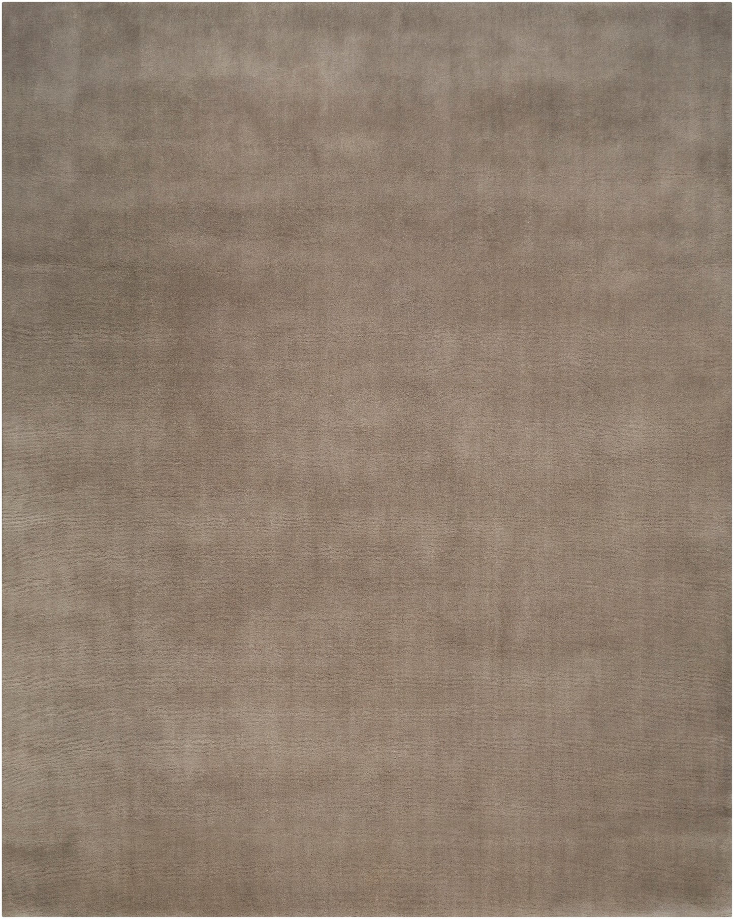 Taupe-brown area rug with subtle marled texture and soft, woven finish.