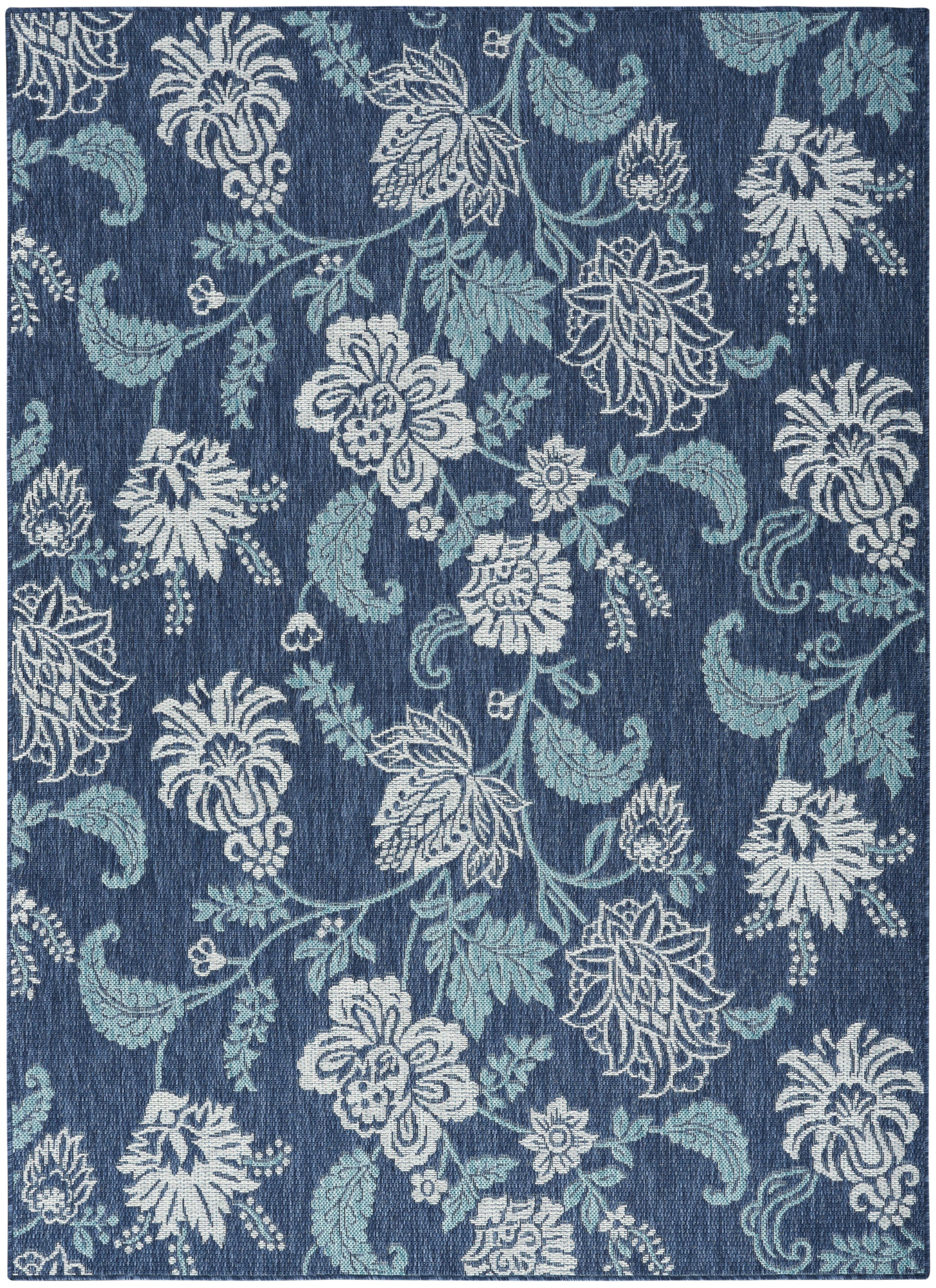Blue floral damask rug with white & light teal blossoms & vines on a deep indigo background.