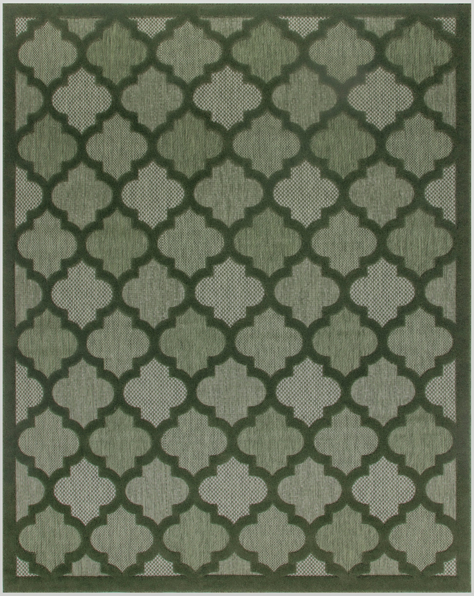 Dark green Moroccan trellis rug on olive backdrop with interlocking quatrefoil shapes and bordered edges.