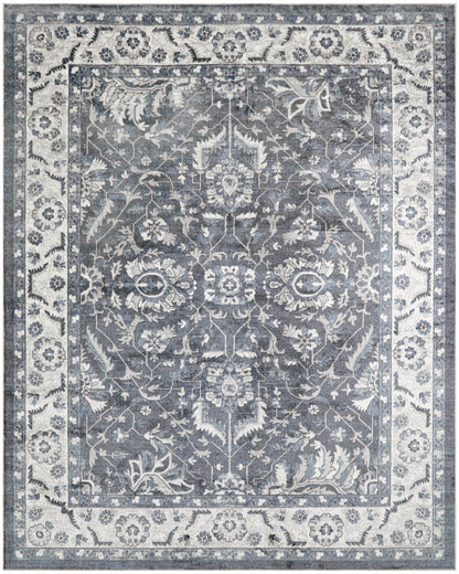 Rectangular blue-gray oriental area rug with ivory floral vines and a decorative border; Persian-inspired living room decor.