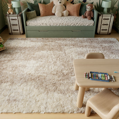 Beige shag rug on wood floor, mint-green kids' daybed with plush bears and monkeys, wooden table and chairs.