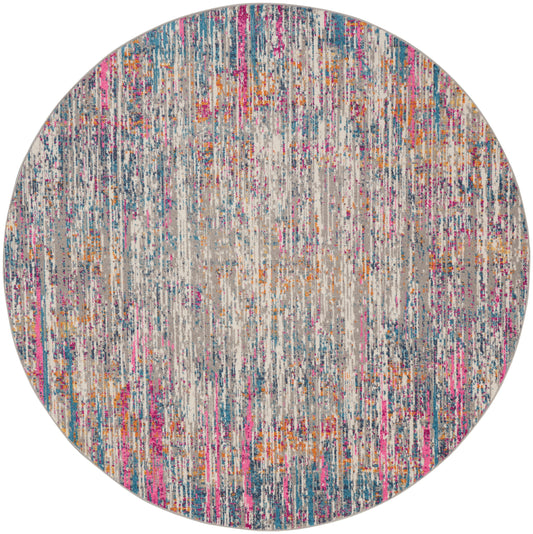 Round area rug with abstract multicolor vertical streaks in pink, teal, orange on light grey base.