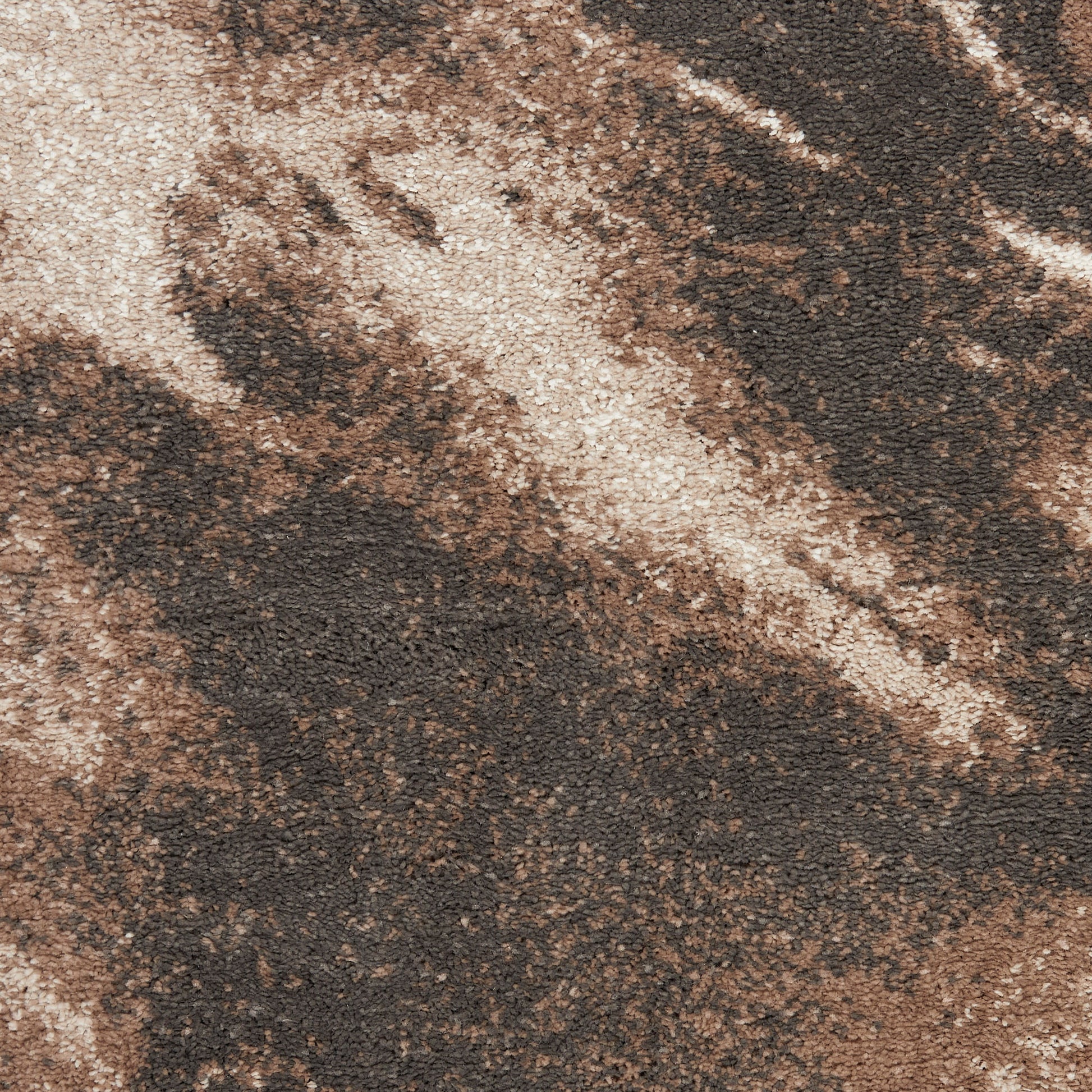 Close-up of a brown and beige marbled shag rug with a plush pile.